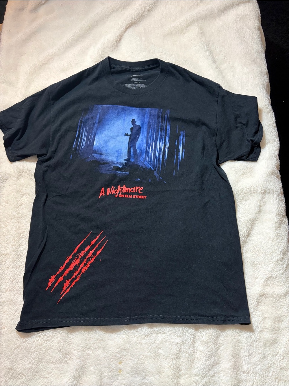 Black Short-Sleeve Graphic Tee with Blue Horror Scene and Red Accents